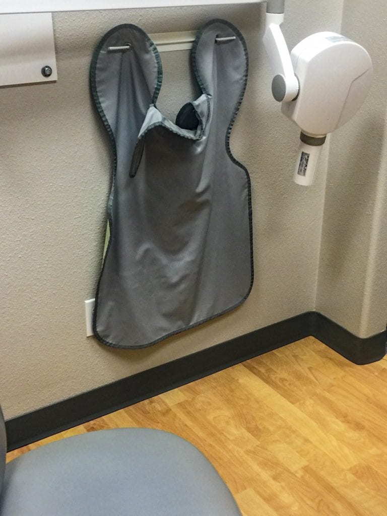Lead apron by a dental xray machine