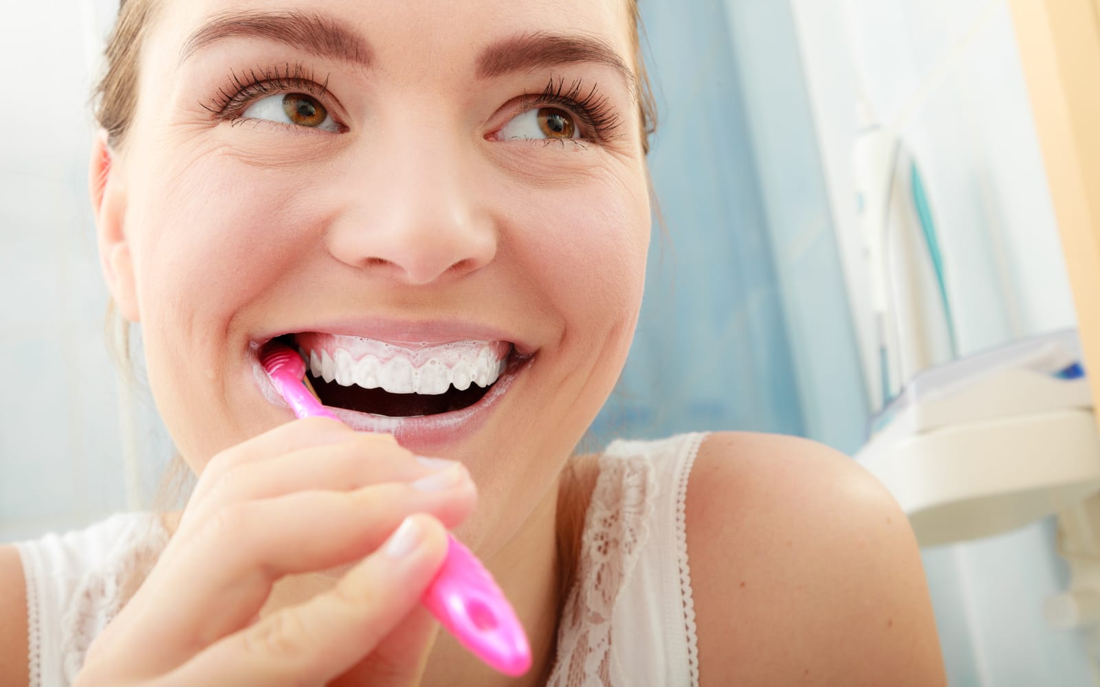 Woman smiling while brushing